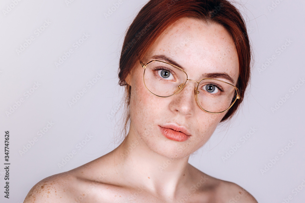 Beautiful woman natural face freckles casual female portrait lifestyle beauty girl in glasses Beautiful woman natural face freckles casual female portrait lifestyle beauty girl in glasses