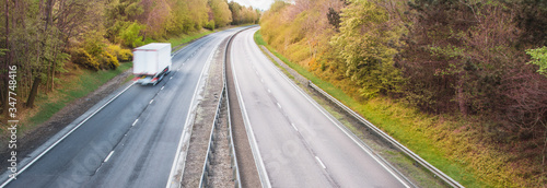 Fotografija HGV vehicle on a dual carriageway - motorway traffic in UK - driving test for lo