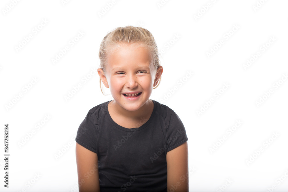 Emotional portrait of a European beautiful girl. The child shows grimaces: laughter, joy, happiness, antics. Photoshoot with different emotions. Emotional portrait of a European beautiful girl. The child shows grimaces: laughter, joy, happiness, antics. Photoshoot with different emotions.