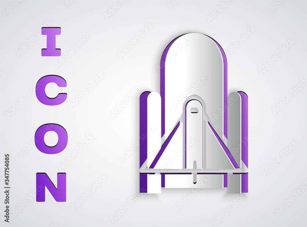 Paper cut Rocket launch from the spaceport icon isolated on grey background. Launch rocket in space. Paper art style. Vector Illustration Paper cut Rocket launch from the spaceport icon isolated on grey background. Launch rocket in space. Paper art style. Vector Illustration