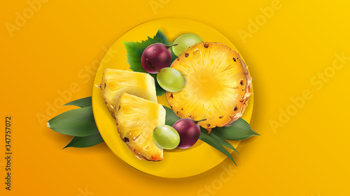 Pineapple and grape on a yellow plate.