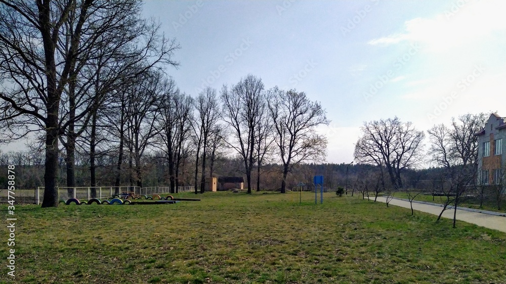 School yard in village at sunny spring day