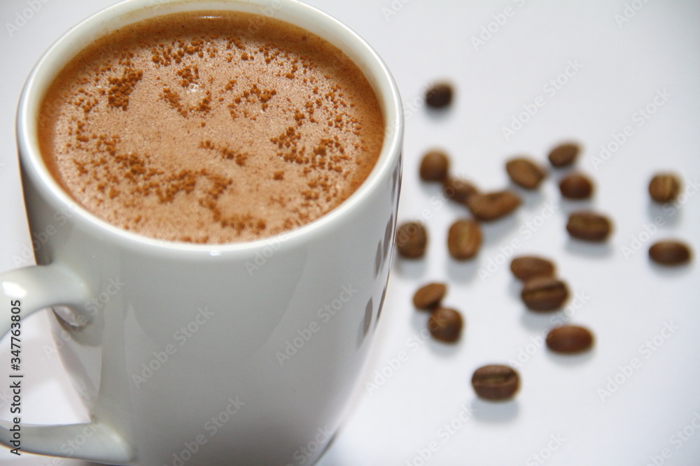 cup of coffee with beans on a wihte background cup of coffee with beans on a wihte background