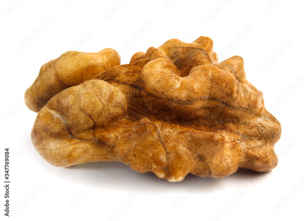 Single half of walnut , isolated on white background, macro shot Single half of walnut , isolated on white background, macro shot