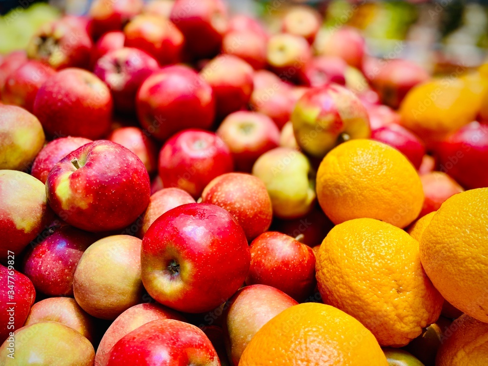 Oranges and apples. A close-up. Mobile photo. Supermarket. Oranges and apples. A close-up. Mobile photo. Supermarket.