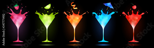 colorful cocktails in martini glasses splashing on black background