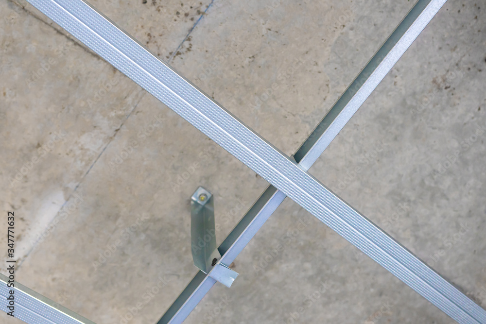 Close up of metal ceiling grid,Acoustical ceiling grid system in construction workplace Close up of metal ceiling grid,Acoustical ceiling grid system in construction workplace
