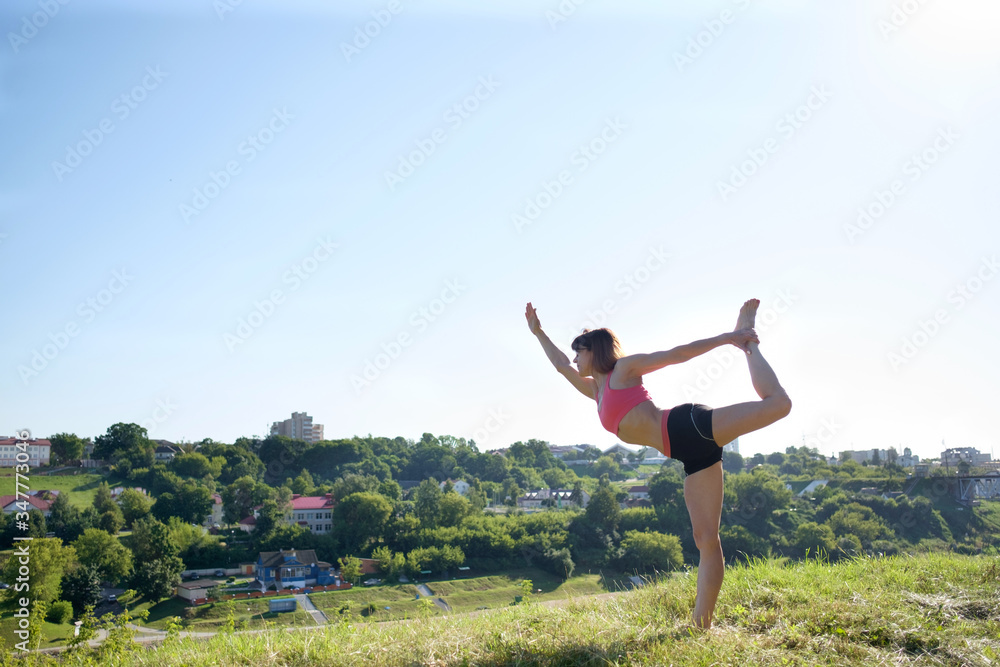Yoga. International day of joga. Attractive fit woman practicing yoga outdoors. Yoga. International day of joga. Attractive fit woman practicing yoga outdoors.
