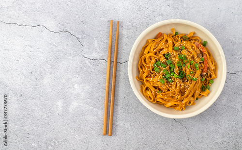 Vegetarian chili noodles. Light background, copy space.