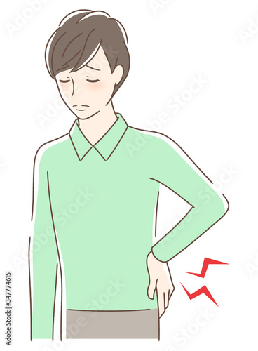 腰痛に悩む男性