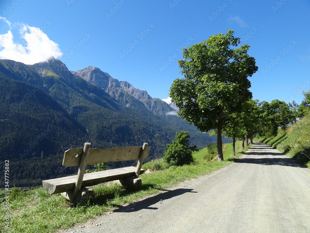 Obraz premium Mountain view including bench in Switzerland