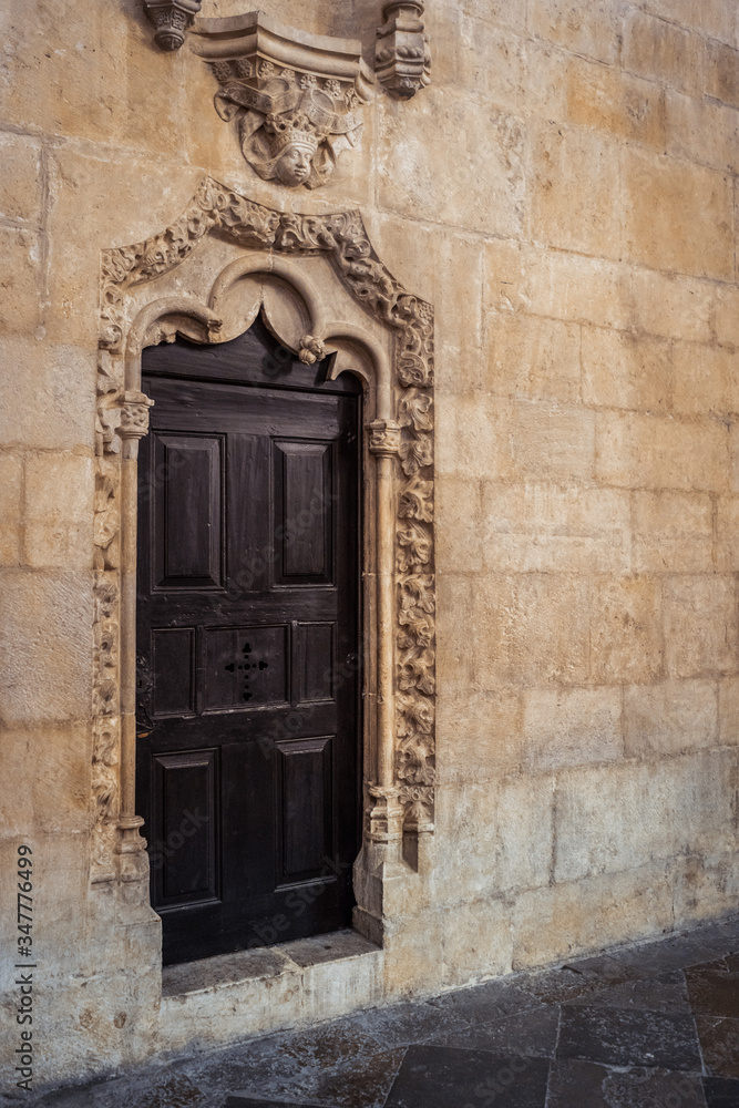 Jeronimos Monastery historic old wooden doors indoors, Lisbon, Portugal