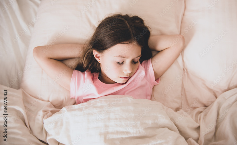 Adorable little girl sleep in the bed close-up Adorable little girl sleep in the bed close-up