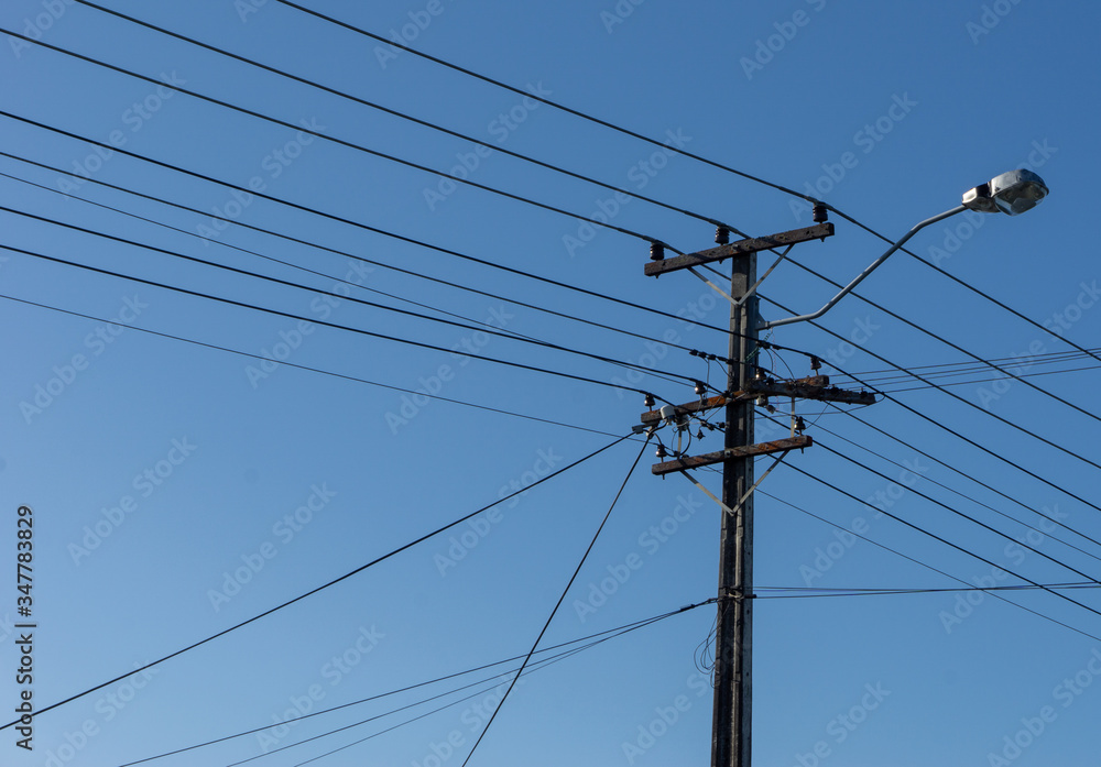 High voltage power lines with a street light