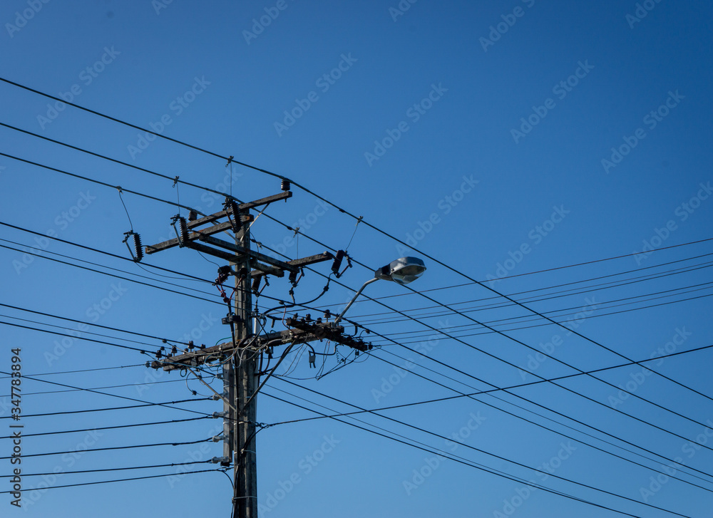 High voltage power lines with a street light