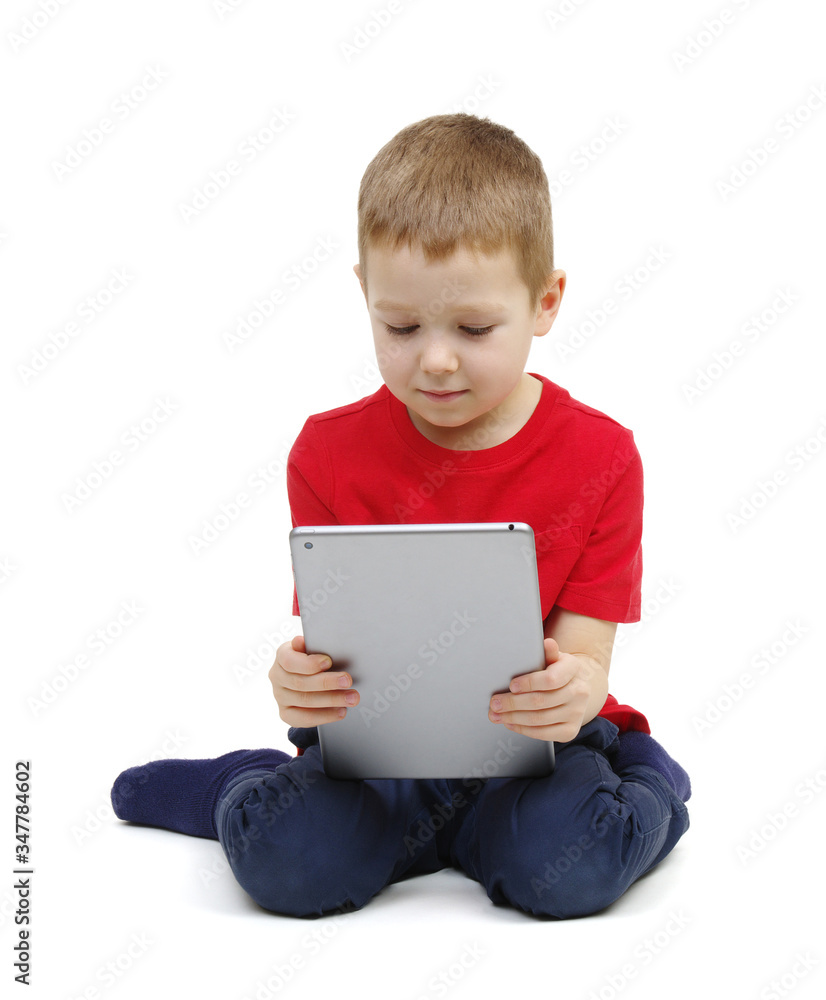 little boy looking at digital tablet computer little boy looking at digital tablet computer