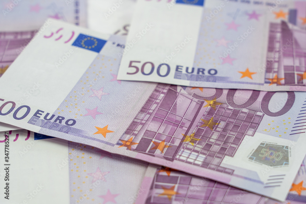 Banknotes of five hundred and 500 euros are scattered in a chaotic manner. European currency blank for design, background. Side view. Banknotes of five hundred and 500 euros are scattered in a chaotic manner. European currency blank for design, background. Side view.