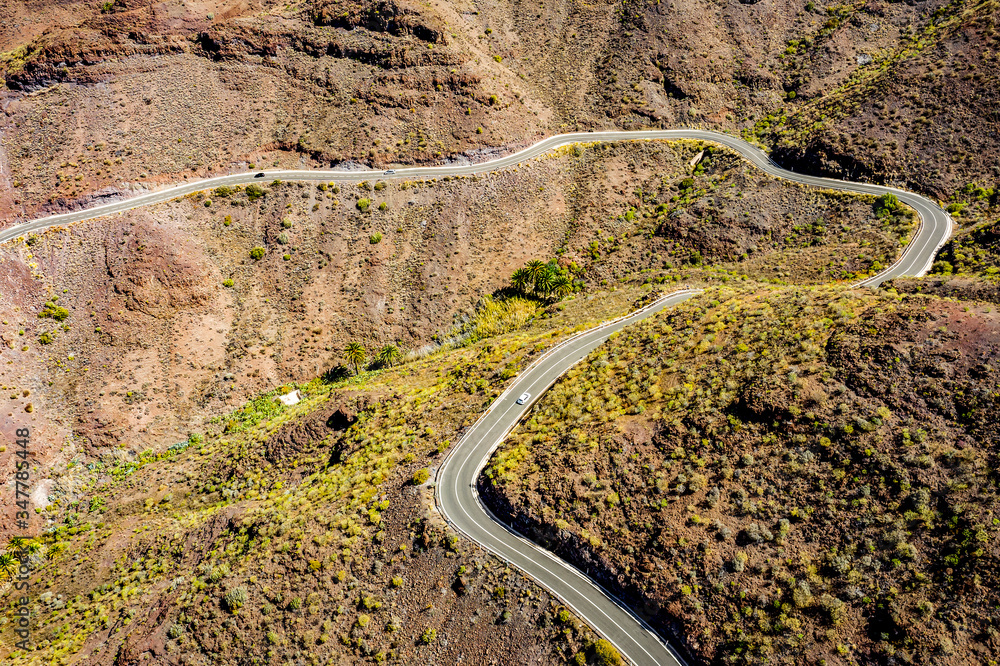 A unique road among high mountains in a beautiful mood of nature A unique road among high mountains in a beautiful mood of nature
