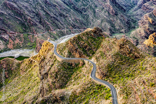 A unique road among high mountains in a beautiful mood of nature