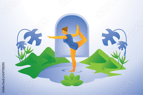Woman performing standing bow pose yoga in forest