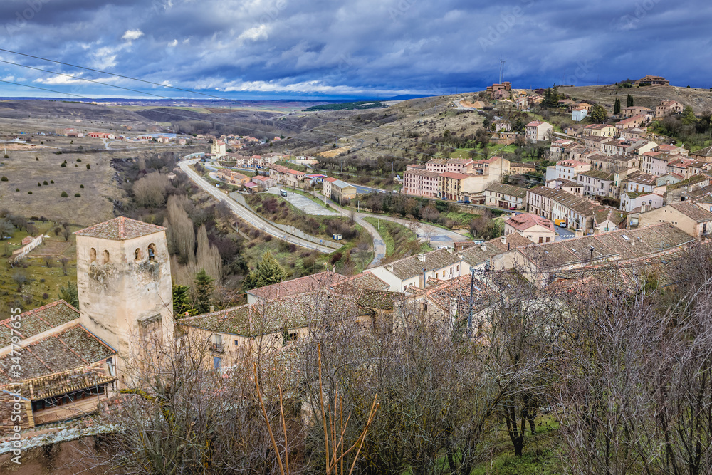 Panorama of historic Sepulveda town in Segovia region - bell tower of San Justo church on foreground, Spain