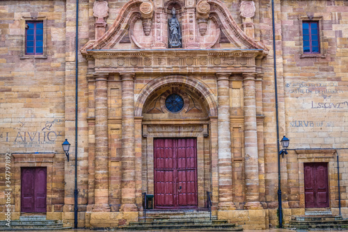 Portal of historic San Isidoro Church on the old part of Oviedo city, Spain