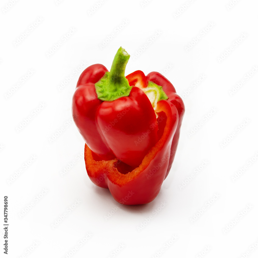 Slices of fresh red sweet pepper are on a white background Slices of fresh red sweet pepper are on a white background