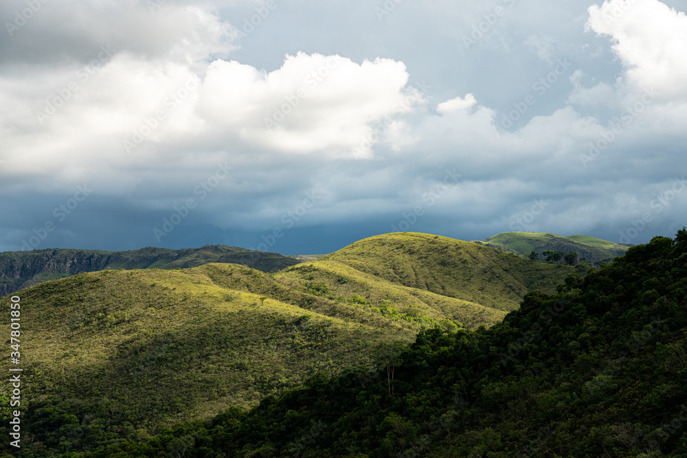 Green hills with trees and cloud sky in Minas Gerais state in Brazil