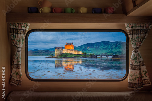 Print op canvas Eilean Donan Castle at dusk, Scotland, view from camper window