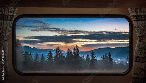Fototapeta Naklejka Na Ścianę i Meble -  Sunset in Tatras in Zakopane, view from camper window