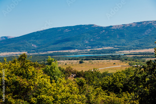 landscape of mountains with forest and blue sky