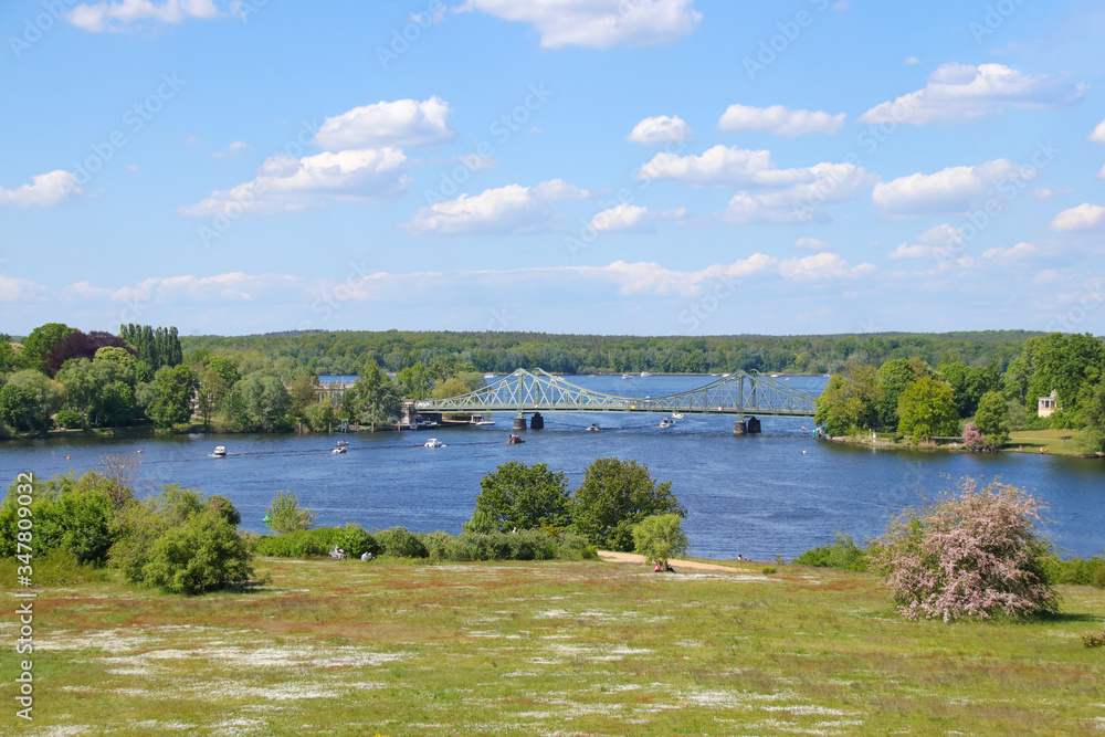 Beautiful view to the famous Glienicke Bridge (Glienicker Bruecke) across the havel river who connecting Berlin with  Brandenburg, Germany