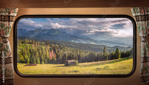 Green valley at sunset in Tatras, view from camper window