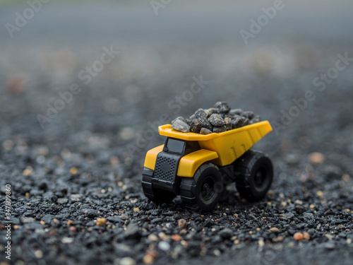 Toy construction machinery working on an excavation
