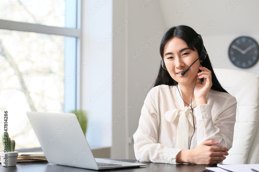 Beautiful Asian secretary working in office Beautiful Asian secretary working in office