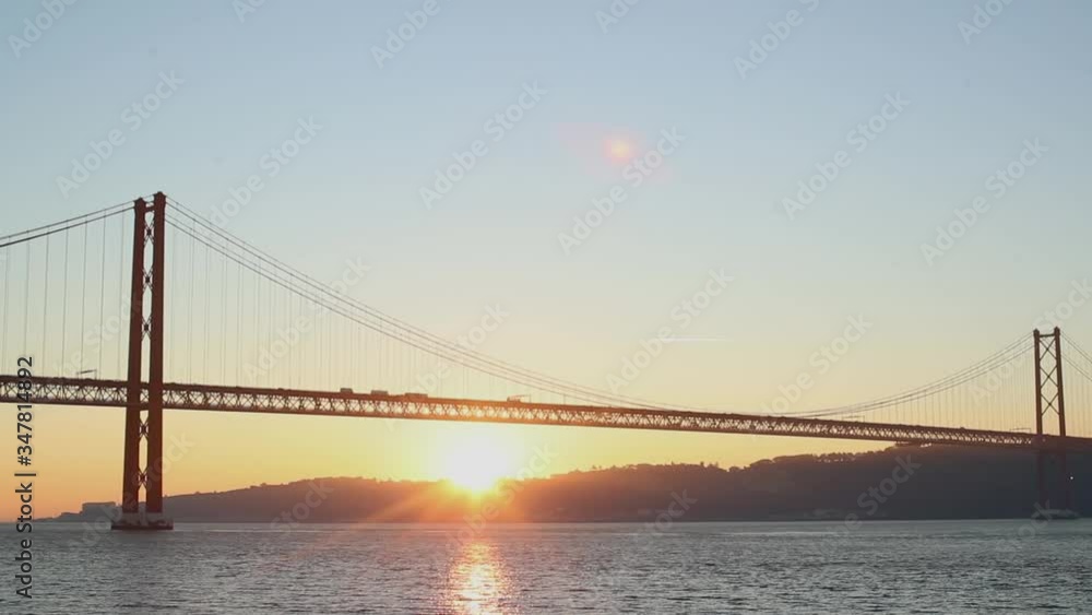 Sunrise over the river bank against the bridge Sunrise over the river bank against the bridge