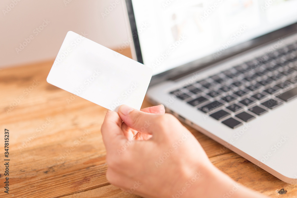 Top view of man using credit card for online shopping Top view of man using credit card for online shopping