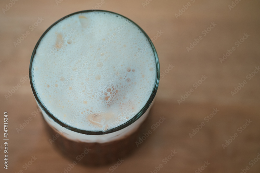 Top view of milk on iced drink Top view of milk on iced drink