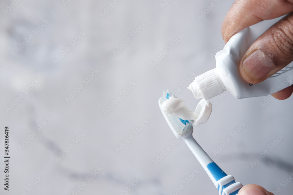 hand holding tooth brush with copy space. hand holding tooth brush with copy space.