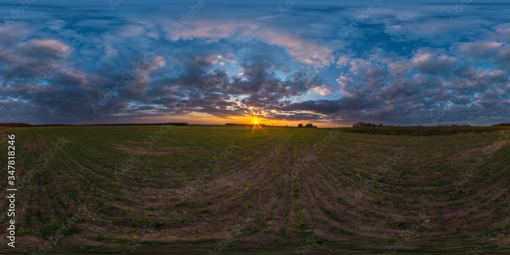 full seamless spherical hdri panorama 360 degrees angle view among fields in summer evening sunset with awesome blue orange red clouds in equirectangular projection, ready for VR AR virtual reality