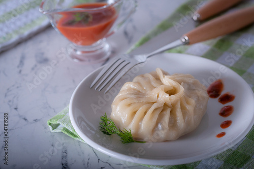 A delicious, diet dish. Steam dumplings. Khinkali Georgian. photo