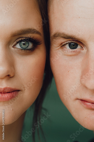 Close-up portrait of a man and a woman nearby. Close-up portrait of people. Bride and groom close to each other.