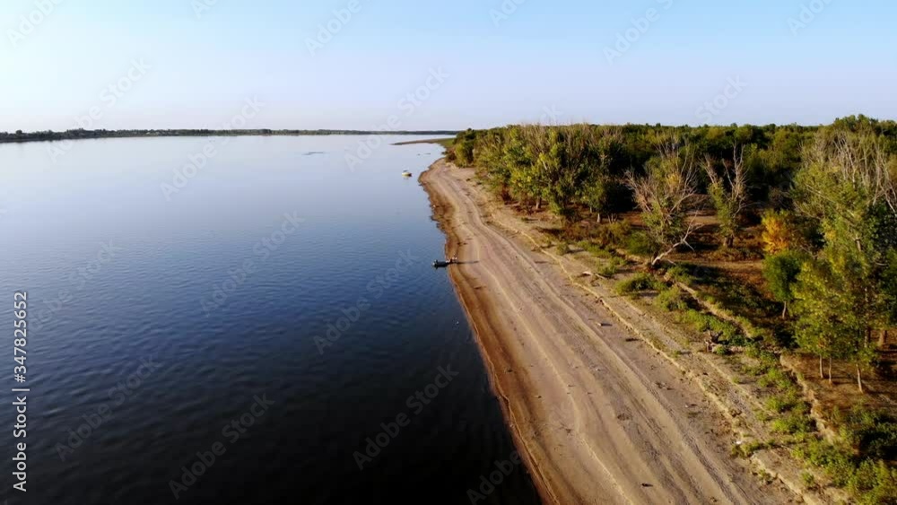 Flight over the beach, river, forest and fishermans Flight over the beach, river, forest and fishermans