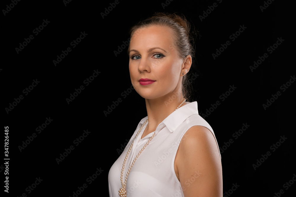 Portrait on a black background young woman who wearing white blouse