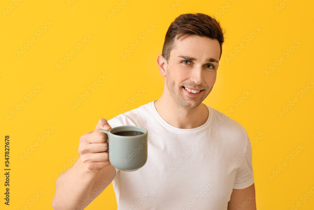 Handsome man with coffee on color background Handsome man with coffee on color background