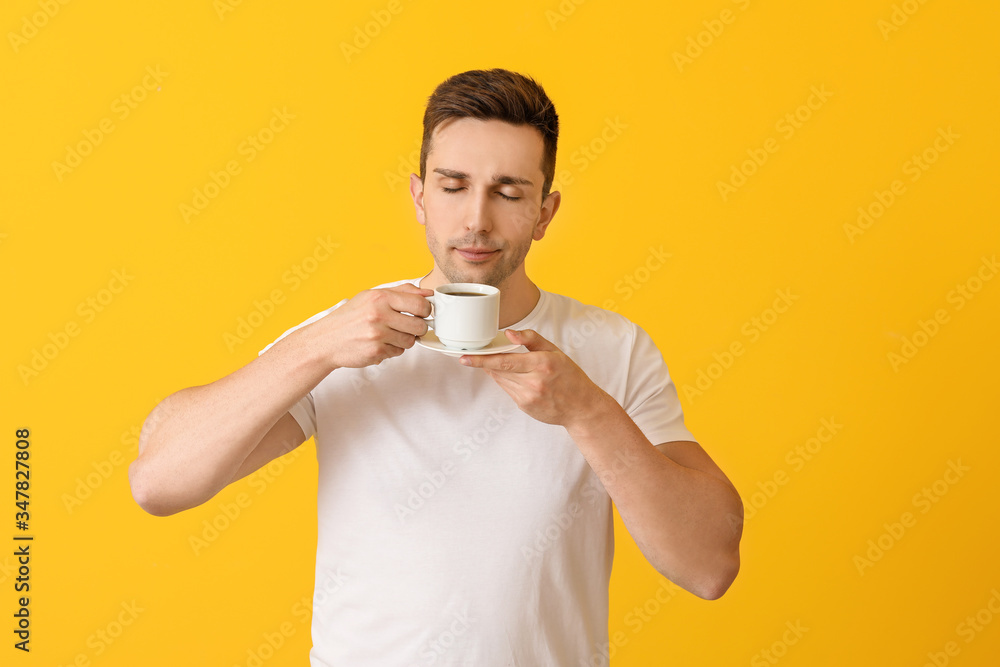 Handsome man with coffee on color background Handsome man with coffee on color background