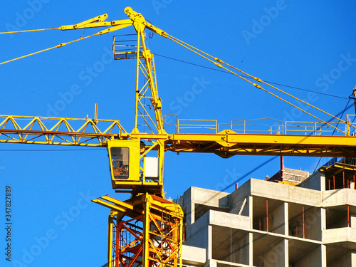 Wallpaper Mural Tower crane and building activity. Construction site background. Torontodigital.ca