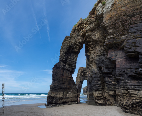 natural arches and caves elephant shaped rock formation at praia de aguas santas beach