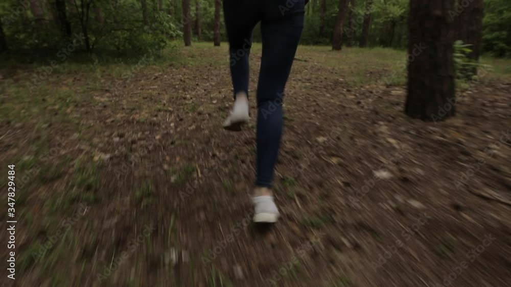 Scared women legs run away in a dense forest, original audio included