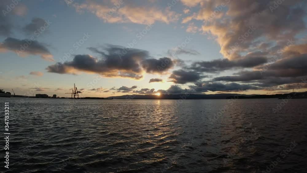 sunset over the mountains in the atlantic ocean in cloudy weather time-lapse sunset over the mountains in the atlantic ocean in cloudy weather time-lapse